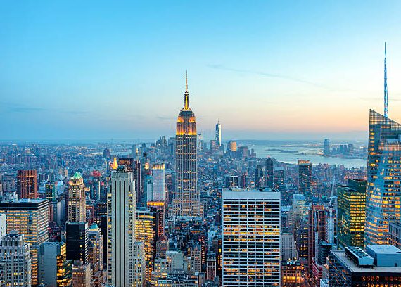 illuminated skyscrapers in Manhattan at evening with Empire State Building and Freedom Tower - the new World Trade Center, New York City